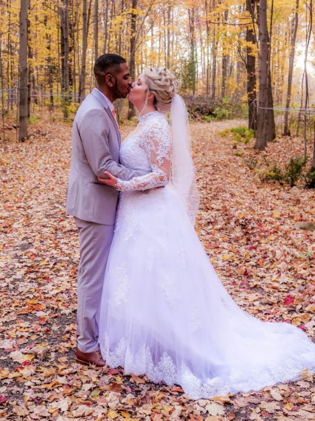 Couple kissing in an autumn forest